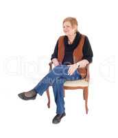 Senior woman relaxing, sitting.