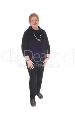 Senior citizen woman standing smiling.