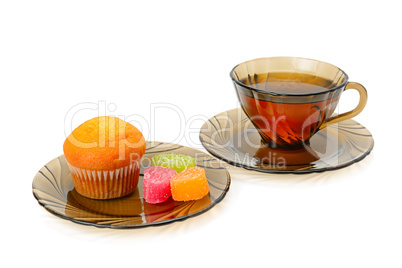 Cup of tea, cupcake and marmalade isolated on white background