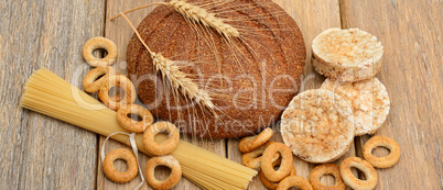 bread, pasta and pastries on a wooden surface