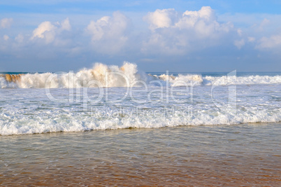 ocean, sandy beach and blue sky