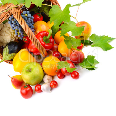 vegetables and fruits in a basket isolated on white background