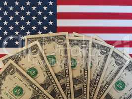 Dollar notes and flag of the United States