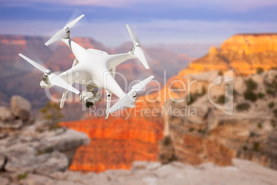 Unmanned Aircraft System (UAV) Quadcopter Drone In The Air Over