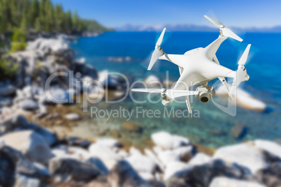 Unmanned Aircraft System (UAV) Quadcopter Drone In The Air Over