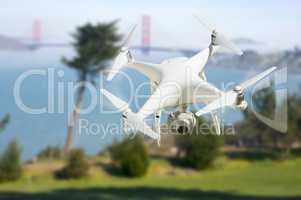 Unmanned Aircraft System (UAV) Quadcopter Drone In The Air Near