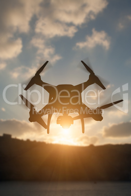 Silhouette of Unmanned Aircraft System (UAV) Quadcopter Drone In