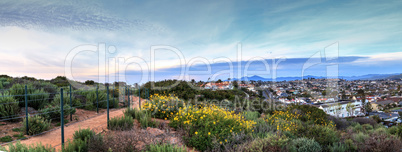 Hiking trail above Dana Point city view at sunset