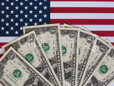 Dollar notes and flag of the United States