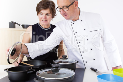 Woman with Chef Cook in the kitchen