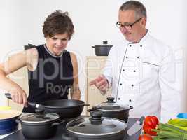 Woman with Chef Cook in the kitchen