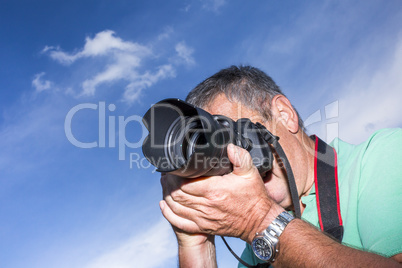 Photographer with a camera when photographing