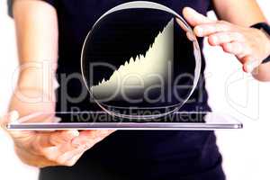 Hand holding tablet pc with glass globe and chart