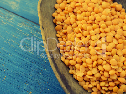 Red lentils on spoon, retro film style