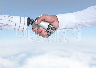 Android Robot hand shaking businessman hand with sky background