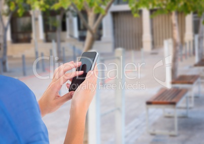 hands with phone in the park