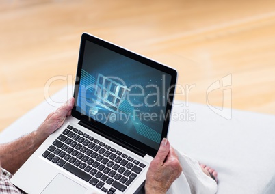 Person using laptop with Shopping trolley icon