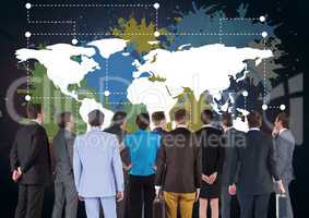Business people in group looking at Colorful Map with paint splatters on wall background