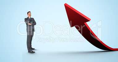 Digital composite image of businessman standing by red arrow
