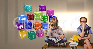 Digital composite image of students studying by application icons