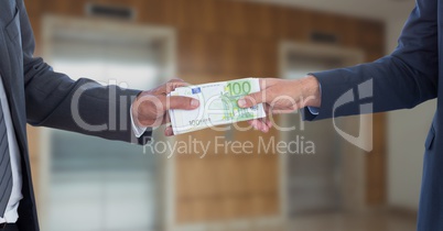 Hands holding money representing corruption concept