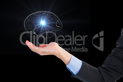Digital composite image of hand holding human brain graphics against black background