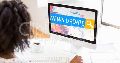 Woman searching for news update on computer