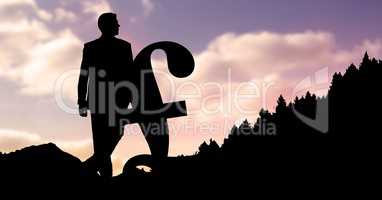 Silhouette businessman with pound sign during sunset