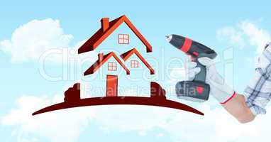 Hand holding drill machine by house shape in sky