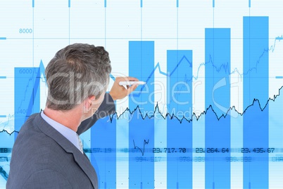 Side view of businessman working on graphs