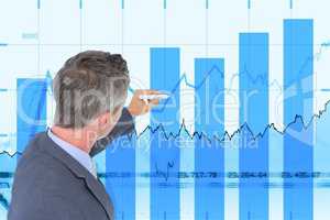 Side view of businessman working on graphs