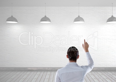 Woman touching air in bright room