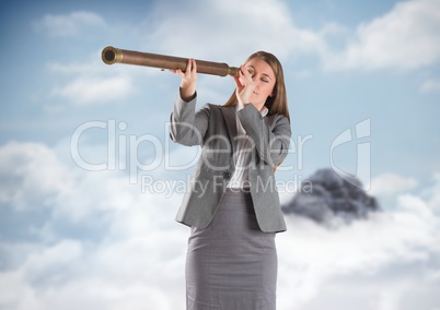 Business woman with telescope against mountain peak in the clouds