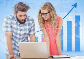 Man and woman at laptop against blue graph