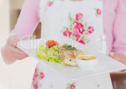 Housewife showing starter dish