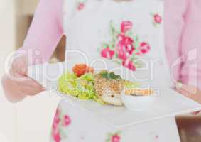 Housewife showing starter dish