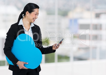 woman holding phone and cloud in office