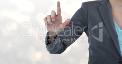 Midsection of businesswoman touching screen