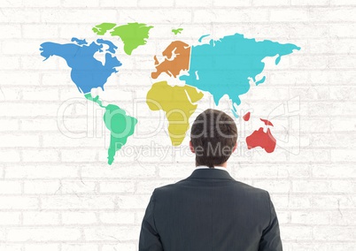 Businessman looking at Colorful Map with wall background