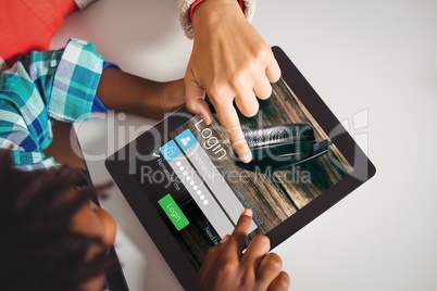 Top view of  hand pointing at tablet screen