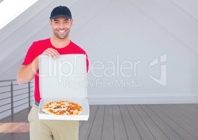 Happy deliveryman showing the pizza in the restaurant