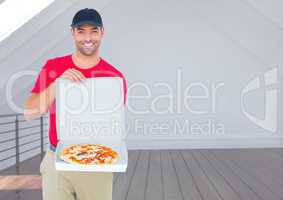 Happy deliveryman showing the pizza in the restaurant