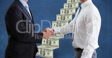 Midsection of businessmen shaking hands with money ladder in background