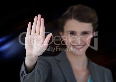 Woman waving with dark background