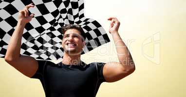 Male runner with hands in air against yellow background and checkered flag