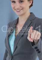 Smiling businesswoman pointing screen