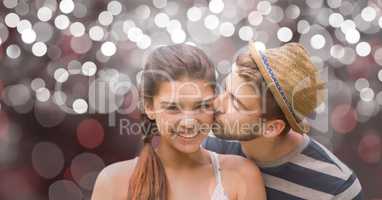 Portrait of happy woman being kissed by man