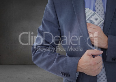 Business man mid section putting money away in grey room