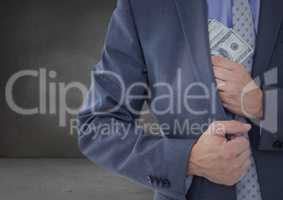 Business man mid section putting money away in grey room