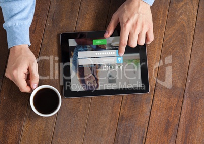 In the table with the coffe and the tablet with login screen